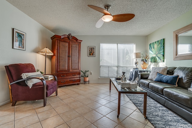 tiled living room with a textured ceiling and ceiling fan