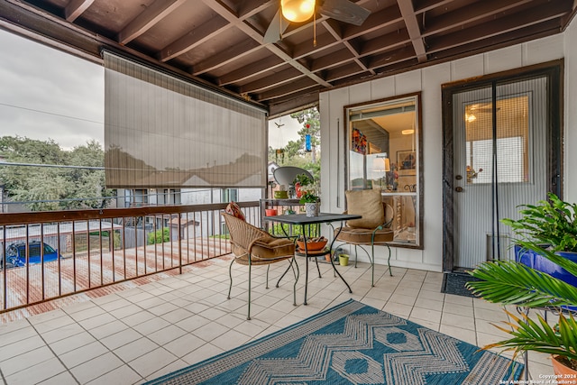 view of patio featuring a balcony and ceiling fan