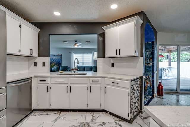 kitchen with dishwasher, white cabinets, sink, and ceiling fan