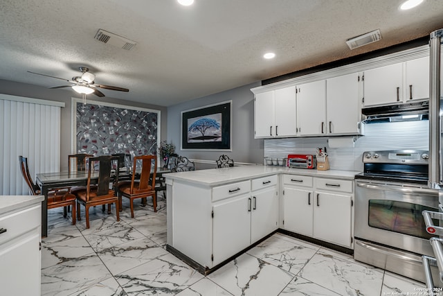 kitchen with stainless steel electric stove, tasteful backsplash, white cabinets, a textured ceiling, and ceiling fan