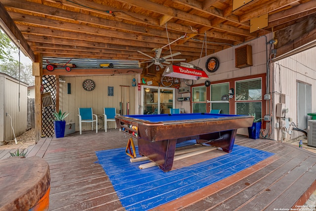 playroom featuring hardwood / wood-style flooring, wooden walls, billiards, and ceiling fan