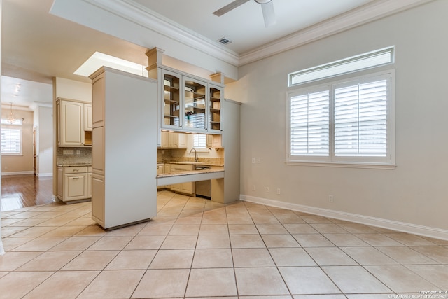 interior space featuring sink, ceiling fan, cream cabinets, light tile patterned flooring, and decorative backsplash