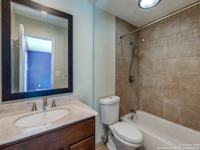 full bathroom with vanity, toilet, and tiled shower / bath