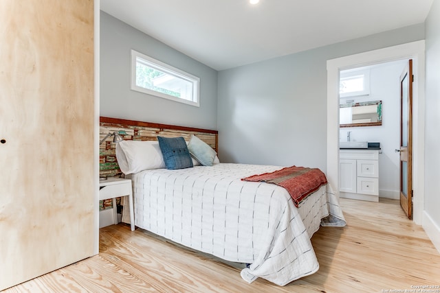 bedroom with light hardwood / wood-style floors