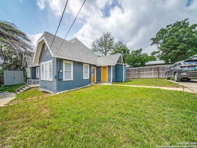 bungalow with a front yard