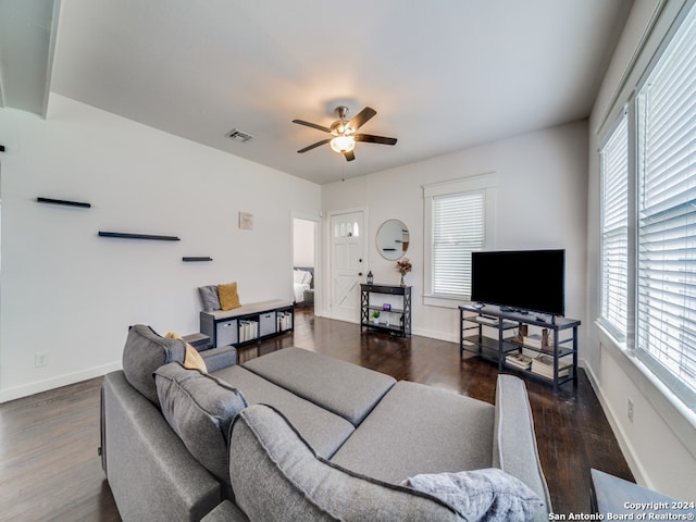 living room with ceiling fan, a healthy amount of sunlight, and dark hardwood / wood-style flooring