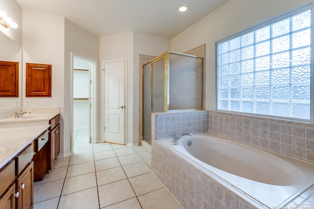 bathroom featuring tile patterned flooring, vanity, and independent shower and bath