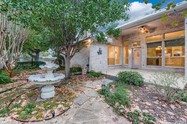 view of yard featuring a patio and ceiling fan