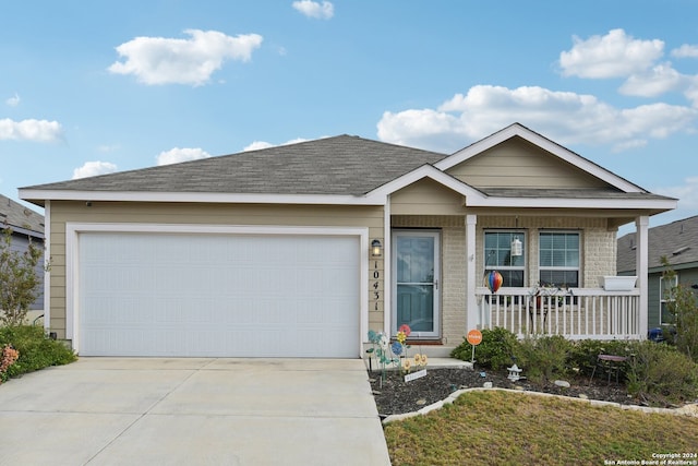 view of front of home featuring a garage and a porch