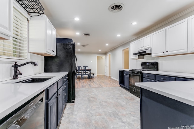 kitchen with crown molding, white cabinetry, black appliances, and sink