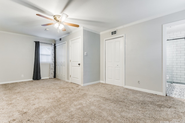 unfurnished bedroom with connected bathroom, ceiling fan, and light colored carpet