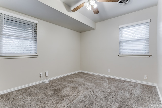 spare room with ceiling fan and carpet flooring