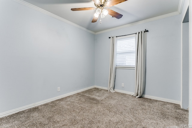 carpeted spare room with ornamental molding and ceiling fan