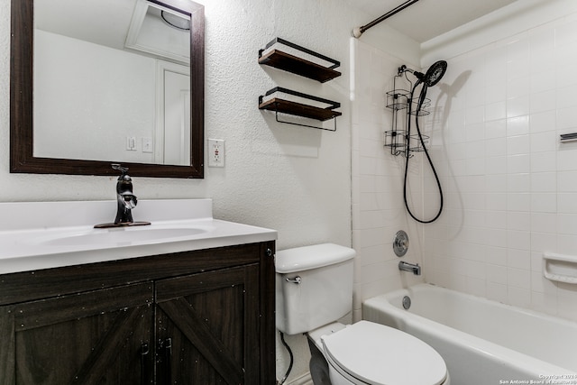 full bathroom with vanity, toilet, and tiled shower / bath