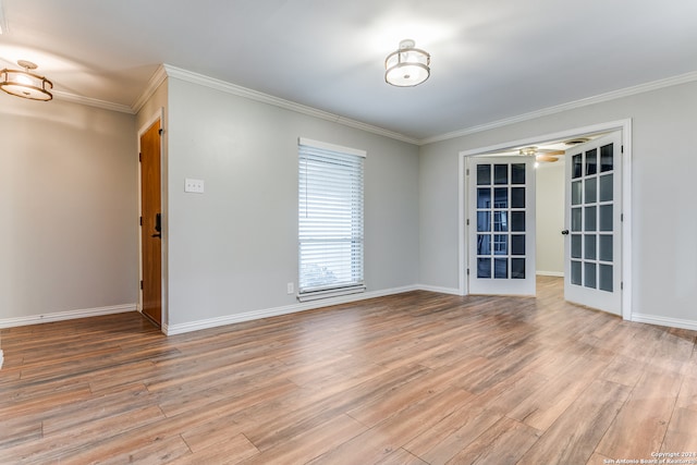 unfurnished room with ornamental molding and light hardwood / wood-style floors