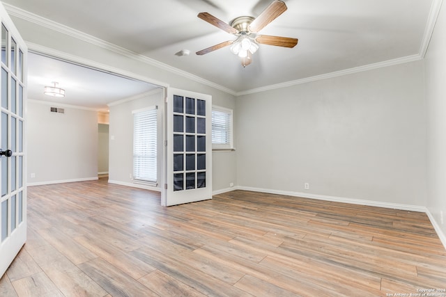 spare room with french doors, light hardwood / wood-style floors, and ceiling fan