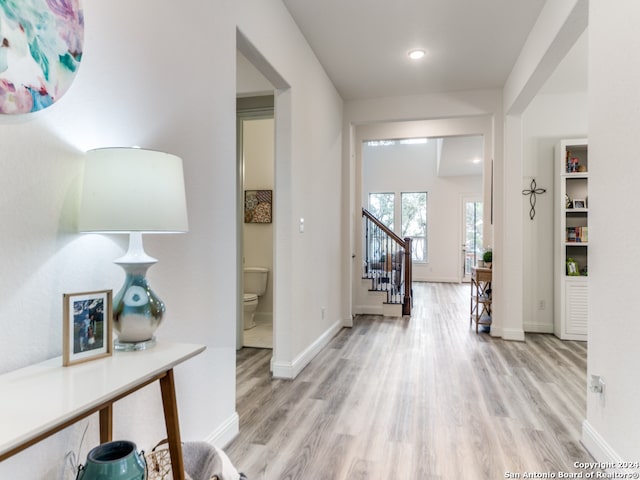 foyer entrance with light hardwood / wood-style floors