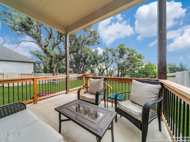 deck featuring a yard, a patio area, and outdoor lounge area