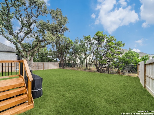 view of yard featuring a wooden deck