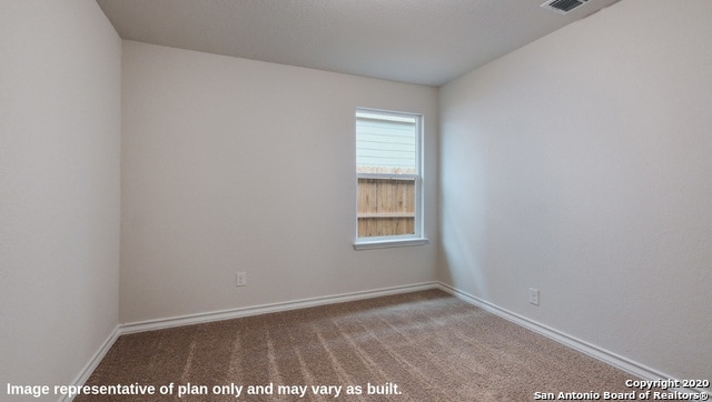 view of carpeted spare room