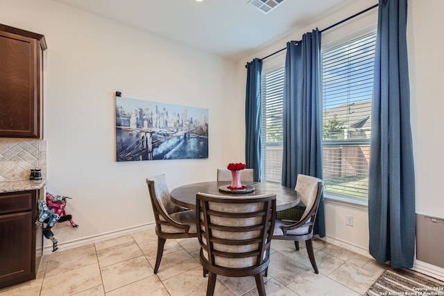 dining space with light tile patterned floors