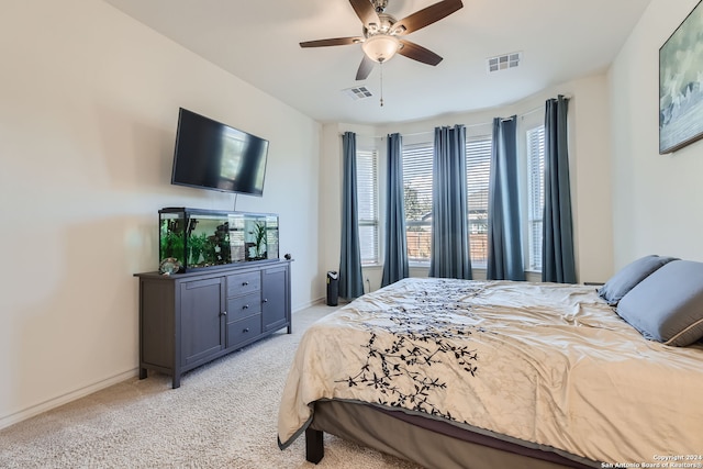 bedroom featuring light colored carpet and ceiling fan