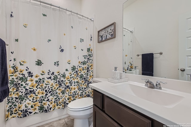 full bathroom with vanity, toilet, shower / bath combo with shower curtain, and tile patterned flooring