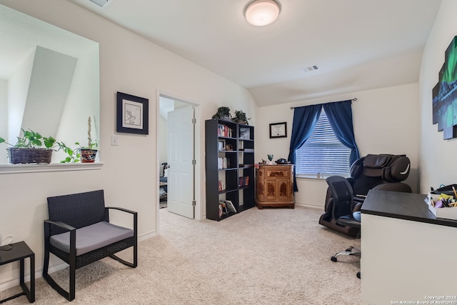 carpeted office featuring vaulted ceiling