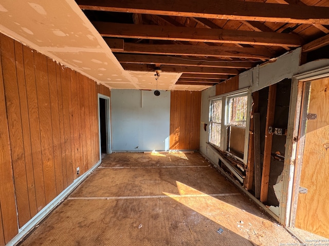 miscellaneous room featuring wood walls