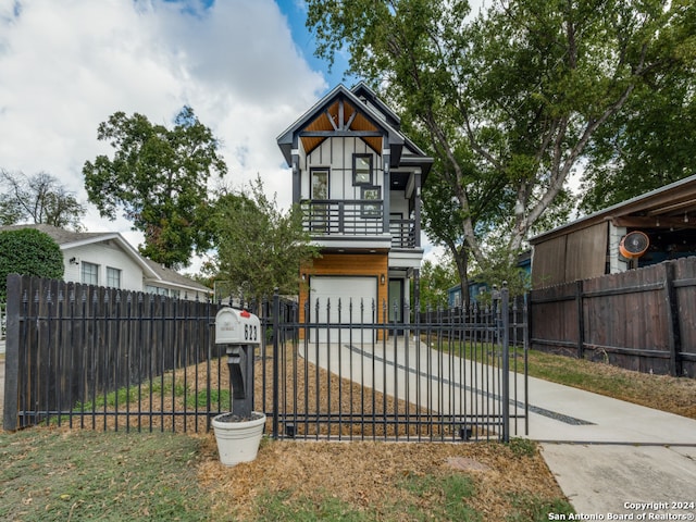 view of front of house with a balcony and a garage