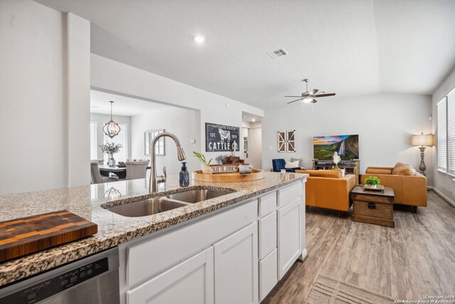 kitchen with sink, white cabinetry, dishwasher, and plenty of natural light