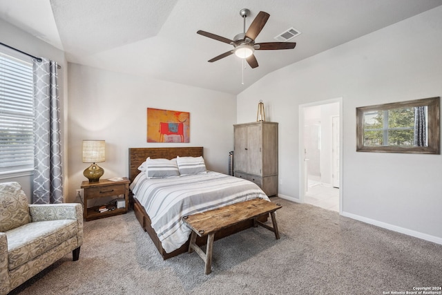 carpeted bedroom featuring connected bathroom, ceiling fan, and vaulted ceiling