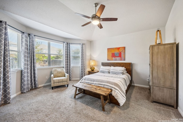 bedroom with a textured ceiling, carpet floors, and ceiling fan