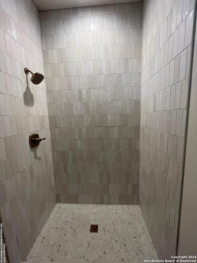 bathroom with a tile shower