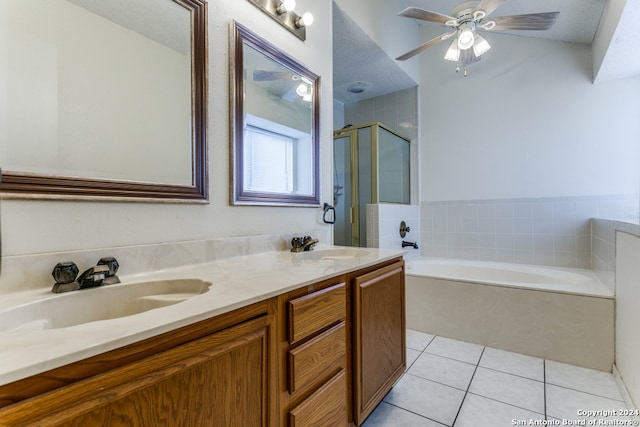 bathroom with shower with separate bathtub, a textured ceiling, ceiling fan, tile patterned floors, and vanity