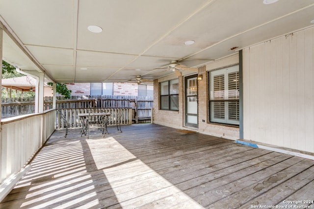 wooden terrace featuring ceiling fan