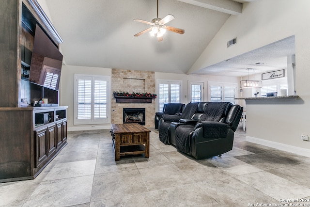 living room featuring beam ceiling, ceiling fan, high vaulted ceiling, and a wealth of natural light