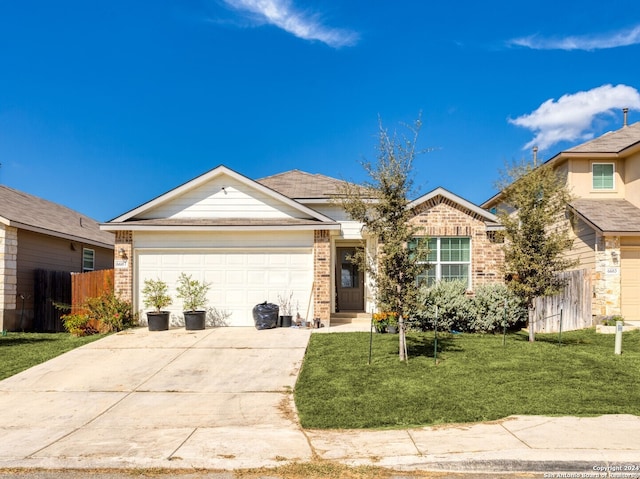 view of front facade featuring a front lawn and a garage