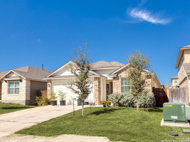 view of front facade featuring a front yard and a garage