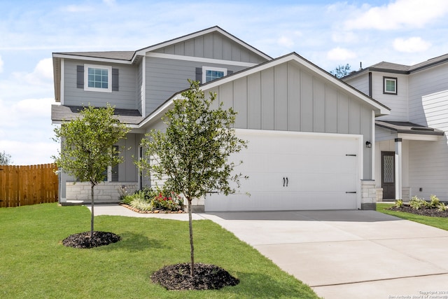 craftsman inspired home featuring a front lawn and a garage