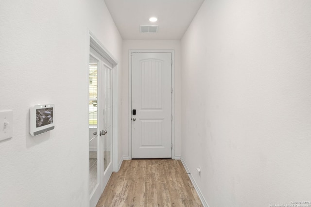 doorway to outside featuring light wood-type flooring