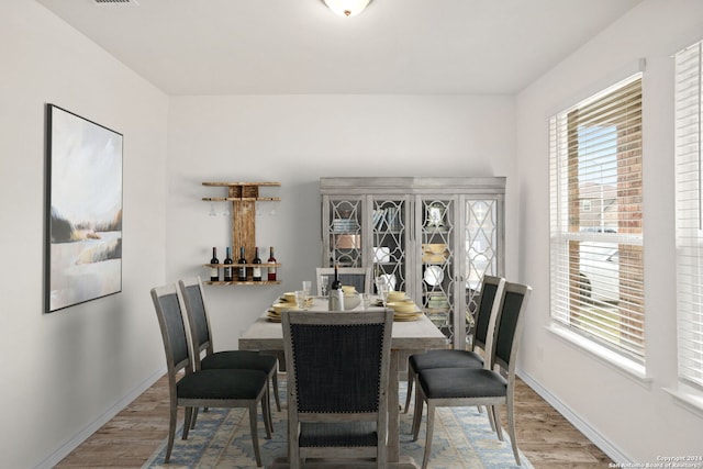 dining space featuring wood-type flooring