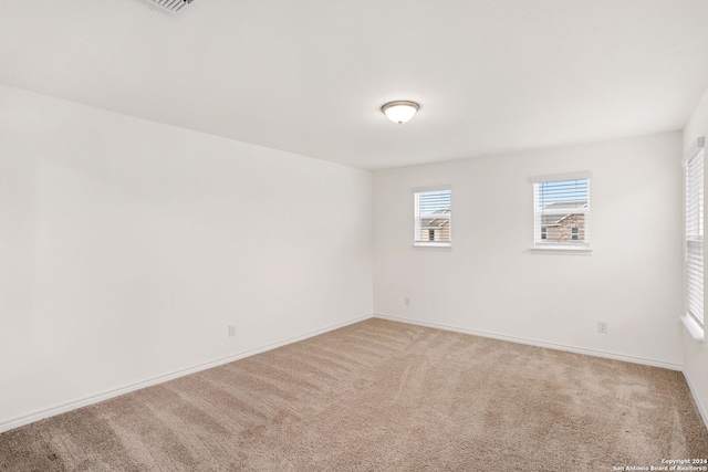 spare room featuring carpet flooring