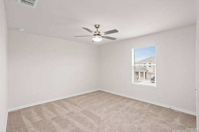 carpeted empty room with ceiling fan