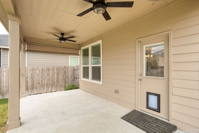 view of patio featuring ceiling fan