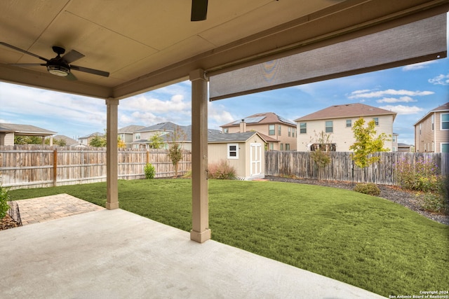 view of patio featuring a storage shed and ceiling fan