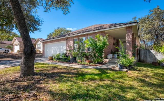 ranch-style house with a front yard and a garage