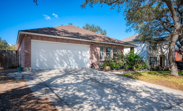 ranch-style house featuring a garage