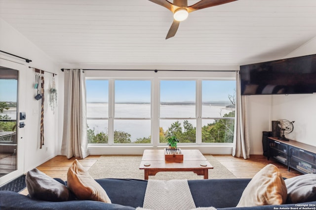 living room featuring ceiling fan and light wood-type flooring