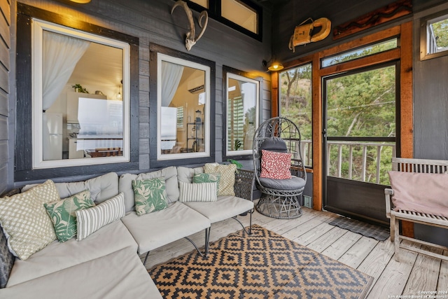 sunroom / solarium with a wealth of natural light and a wall mounted AC